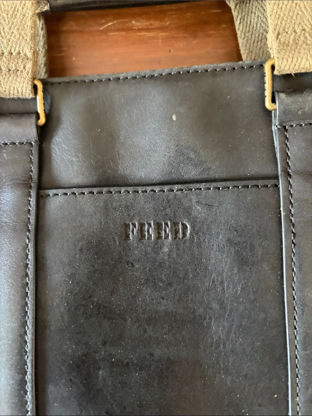 FEED Black Leather Messenger Bag with Brown Strap Web Adjustable Strap
